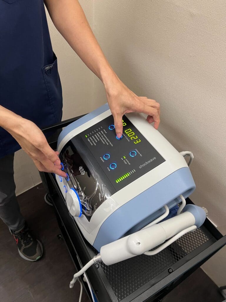 What should I do if the shockwave therapy machine is broken?